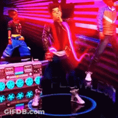 A Man In A Red Jacket Is Singing Into A Microphone In Front Of A Purple Wall GIF