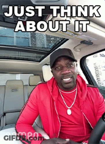 A Man In A Red Jacket Is Sitting In A Car With A Caption That Says Just Think About It . GIF