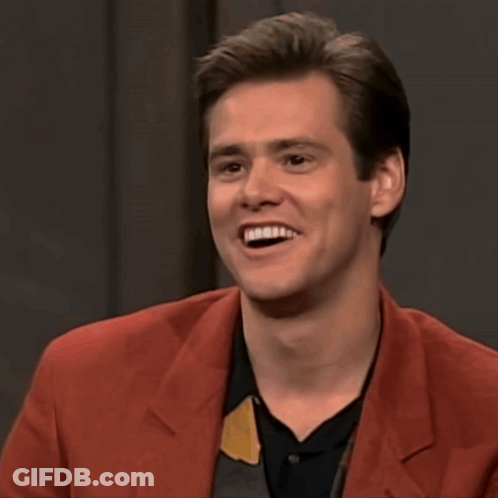A Man In A Red Jacket Is Smiling With The Words That 'S Really Funny Below Him GIF
