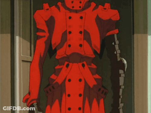 A Man In A Red Jacket Is Standing In A Doorway And Smiling GIF