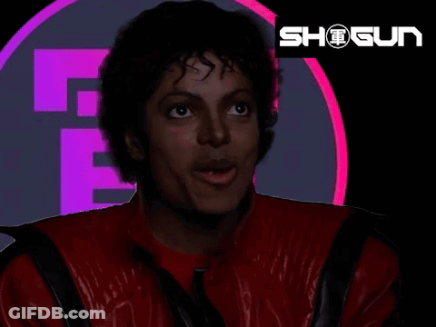 A Man In A Red Jacket Is Standing In Front Of A Logo That Says Shogun GIF