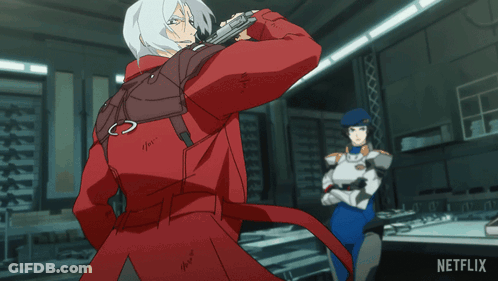 A Man In A Red Jacket Is Standing Next To A Woman In A Blue Uniform With A Netflix Logo On The Bottom Right GIF