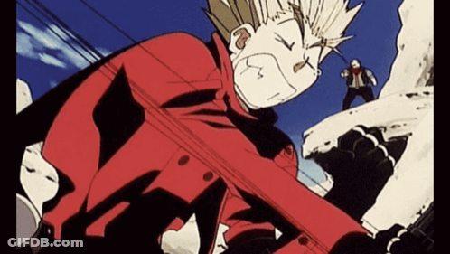 A Man In A Red Jacket Is Standing On Top Of A Snowy Hill GIF