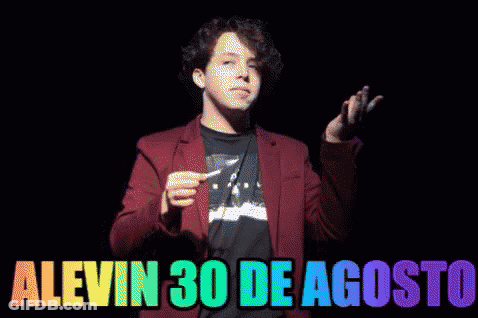 A Man In A Red Jacket Lighting A Match With The Words Alevin 30 De Agosto Written Below Him GIF