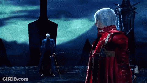 A Man In A Red Jacket Stands In Front Of A Man In A Blue Suit GIF