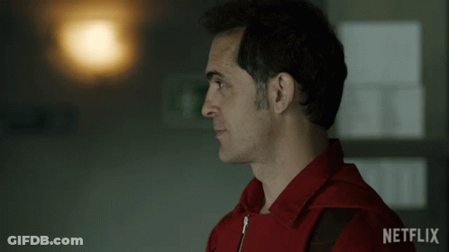 A Man In A Red Jacket With Netflix On The Bottom Right GIF