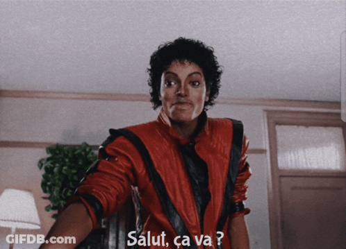 A Man In A Red Jacket With Salut Ca Va Written On The Bottom GIF