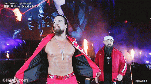 A Man In A Red Jacket With The Number 14 On The Bottom Right GIF