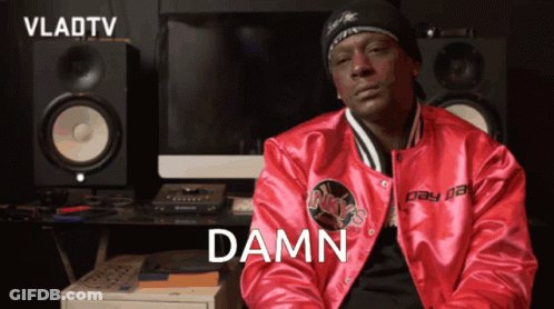 A Man In A Red Jacket With The Word Damn Written On It GIF