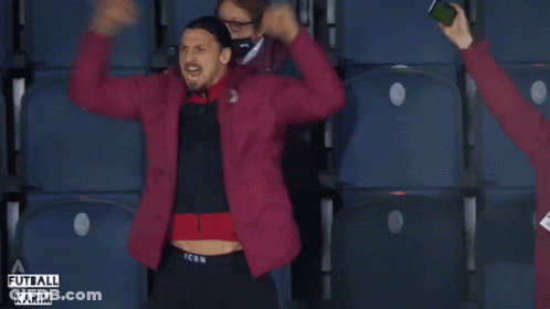 A Man In A Red Jacket With The Word Icon On The Bottom GIF