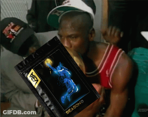 A Man In A Red Jersey Is Holding A Bag That Says Season On It GIF
