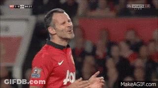 A Man In A Red Jersey With The Letter J On It Is Clapping GIF