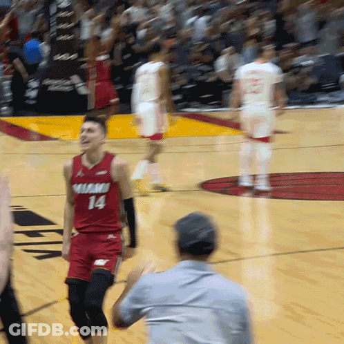 A Man In A Red Jersey With The Number 14 On The Front GIF
