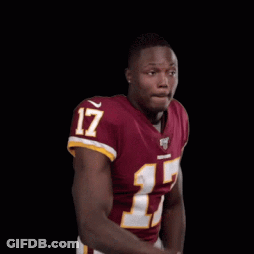 A Man In A Red Jersey With The Number 17 On It Is Making A Funny Face . GIF