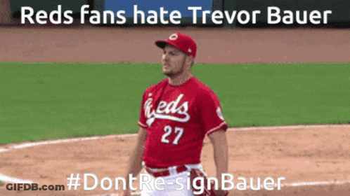 A Man In A Red Jersey With The Number 27 Stands On A Baseball Field GIF