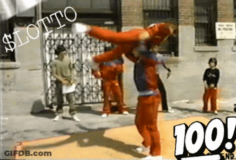 A Man In A Red Jumpsuit Is Doing A Trick In Front Of A Sign That Says $ Lotto GIF