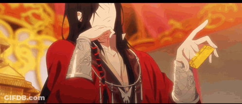 A Man In A Red Kimono Is Holding A Gold Object In His Hand . GIF