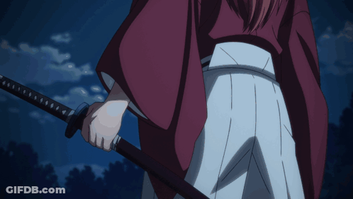 A Man In A Red Kimono Is Holding A Sword GIF