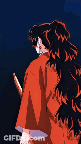 A Man In A Red Kimono Is Holding A Sword In His Hand GIF