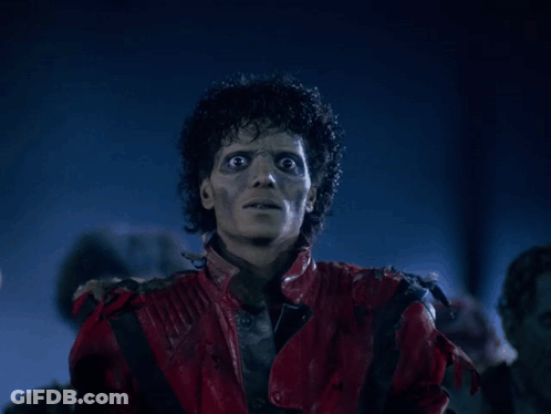A Man In A Red Leather Jacket Is Looking At The Camera GIF