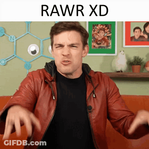 A Man In A Red Leather Jacket Is Making A Funny Face And The Words Rawr Xd Are Above Him GIF