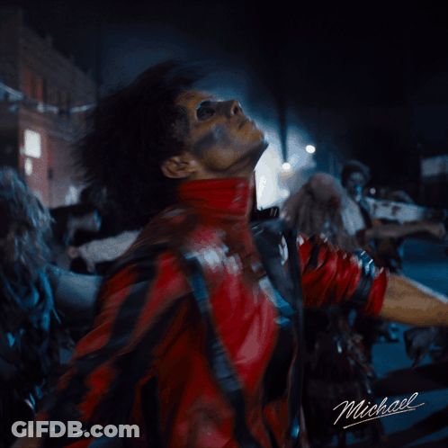 A Man In A Red Leather Jacket With Michael Written On The Bottom GIF