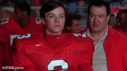 A Man In A Red Nike Jersey With The Number 3 On His Chest GIF