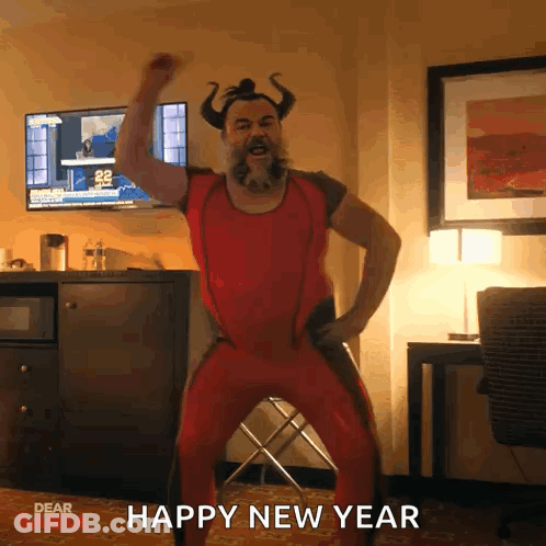 A Man In A Red Outfit With Horns Is Dancing In A Room With The Words Happy New Year Written On The Bottom GIF