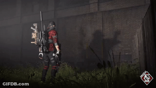 A Man In A Red Plaid Shirt Is Holding A Sniper Rifle In Front Of A Brick Wall GIF