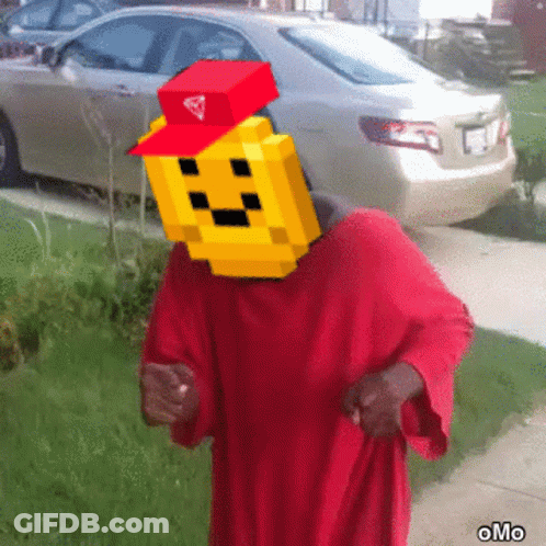 A Man In A Red Robe Has A Pixelated Face On His Head And A Red Hat GIF