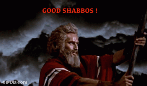 A Man In A Red Robe Is Holding A Sword And The Words Good Shabbos Are Above Him GIF