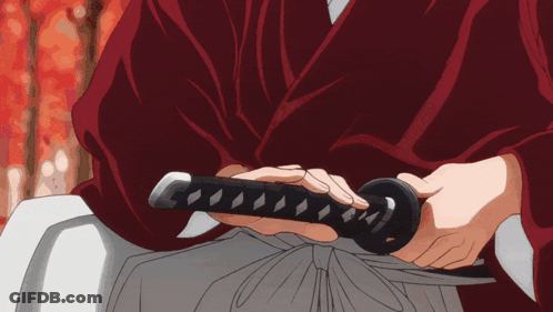 A Man In A Red Robe Is Holding A Sword In His Hands GIF