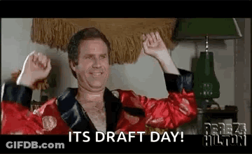 A Man In A Red Robe Is Raising His Arms In The Air And Says `` It 'S Draft Day ! '' GIF