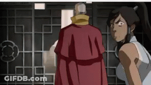 A Man In A Red Robe Is Standing Next To A Woman In A White Shirt . GIF