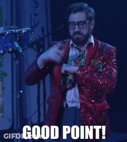 A Man In A Red Sequined Suit And Tie Says Good Point In White Letters GIF
