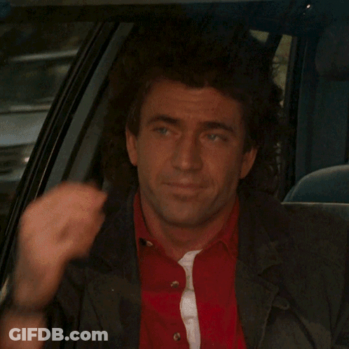 A Man In A Red Shirt And Black Jacket Is Sitting In The Back Seat Of A Car GIF