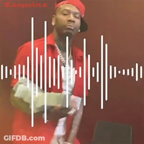 A Man In A Red Shirt And Hat Is Standing In Front Of A Sound Wave GIF