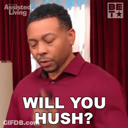 A Man In A Red Shirt Is Asking If Someone Will Hush GIF