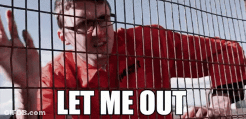 A Man In A Red Shirt Is Behind A Fence With The Words Let Me Out Written On It GIF