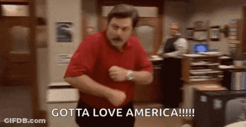 A Man In A Red Shirt Is Dancing In A Room With The Words `` Gotta Love America '' Written On The Bottom . GIF