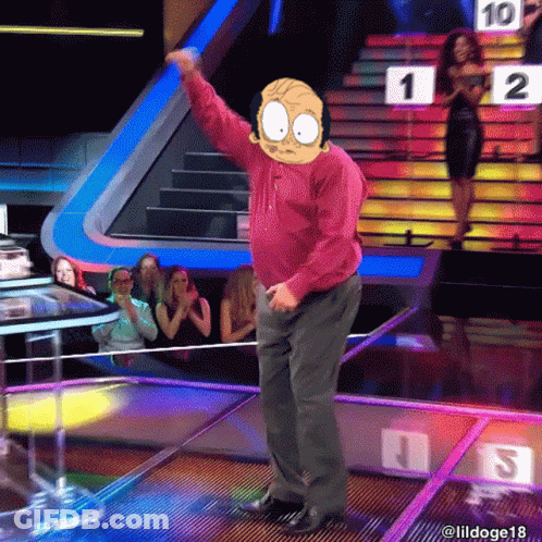 A Man In A Red Shirt Is Dancing On A Stage In Front Of A Crowd With A Sign That Says 1 On It GIF