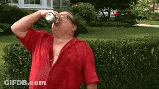 A Man In A Red Shirt Is Drinking From A Can Of Soda GIF
