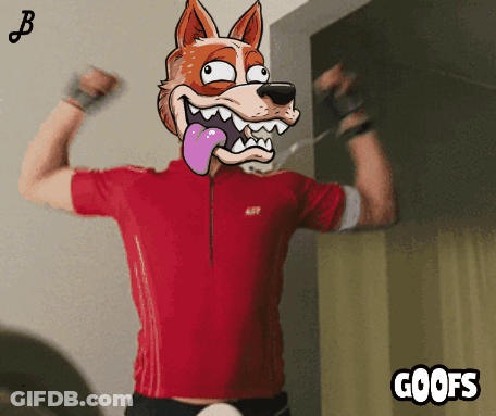 A Man In A Red Shirt Is Flexing His Muscles With A Cartoon Fox On His Head And The Words Goofs Below Him GIF