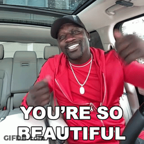 A Man In A Red Shirt Is Giving A Thumbs Up With The Words You 'Re So Beautiful Underneath Him GIF
