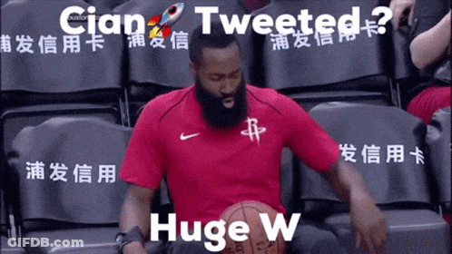 A Man In A Red Shirt Is Holding A Basketball And The Words Tweeted Huge W Are Above Him GIF