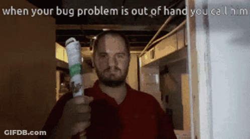 A Man In A Red Shirt Is Holding A Bug Spray In His Right Hand GIF
