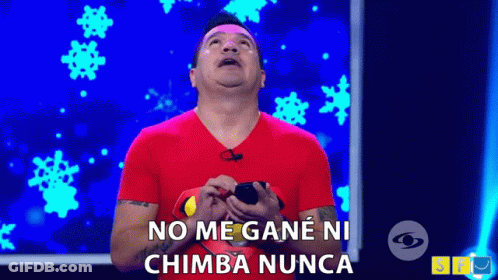 A Man In A Red Shirt Is Holding A Cell Phone And Saying No Me Gane Ni Chimba Nunca . GIF