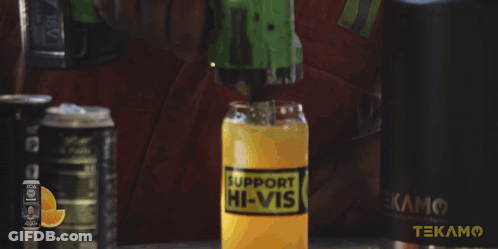A Man In A Red Shirt Is Holding A Hammer In Front Of A Cabinet That Has The Word Tekam On It GIF