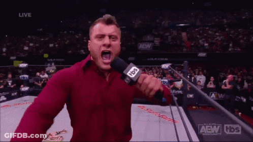 A Man In A Red Shirt Is Holding A Microphone And Says I Am The Best GIF