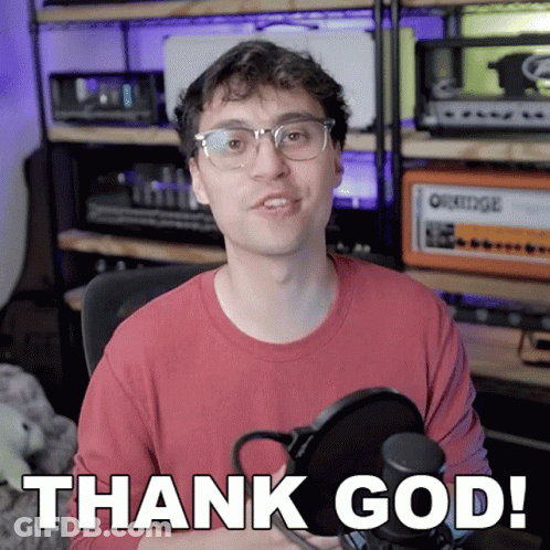A Man In A Red Shirt Is Holding A Microphone And Says Thank God GIF